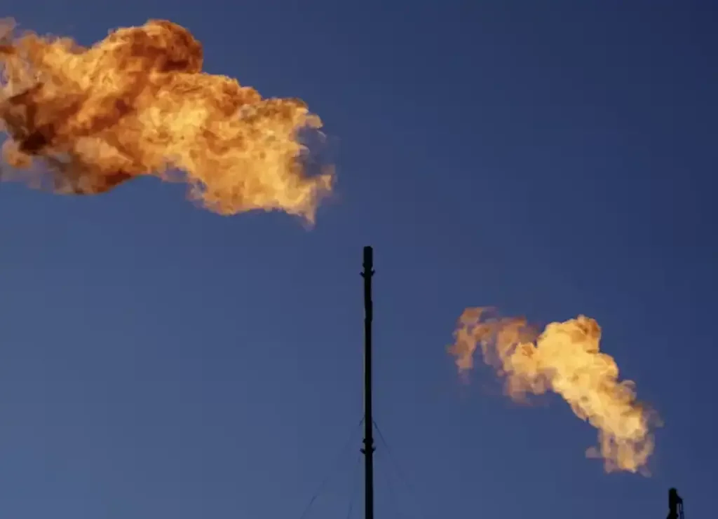 Flares burn off hydrocarbons such as methane at an oil and gas facility.