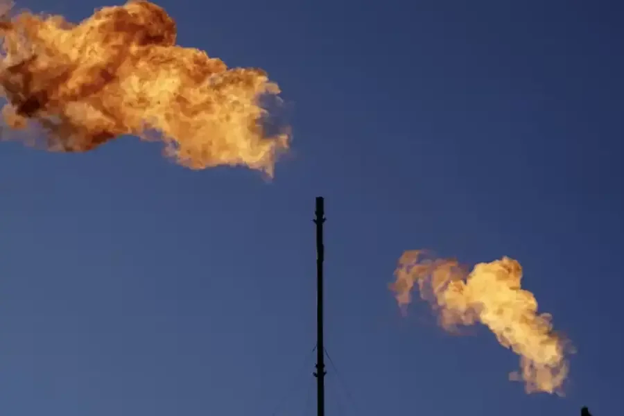 Flares burn off hydrocarbons such as methane at an oil and gas facility.